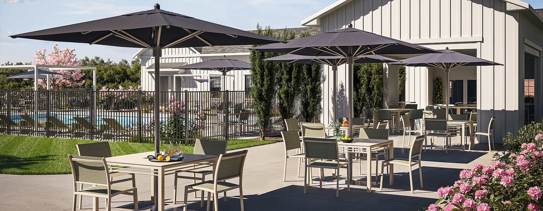 a patio with tables and chairs