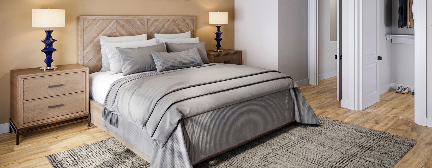 a bed with a white vase on the sides