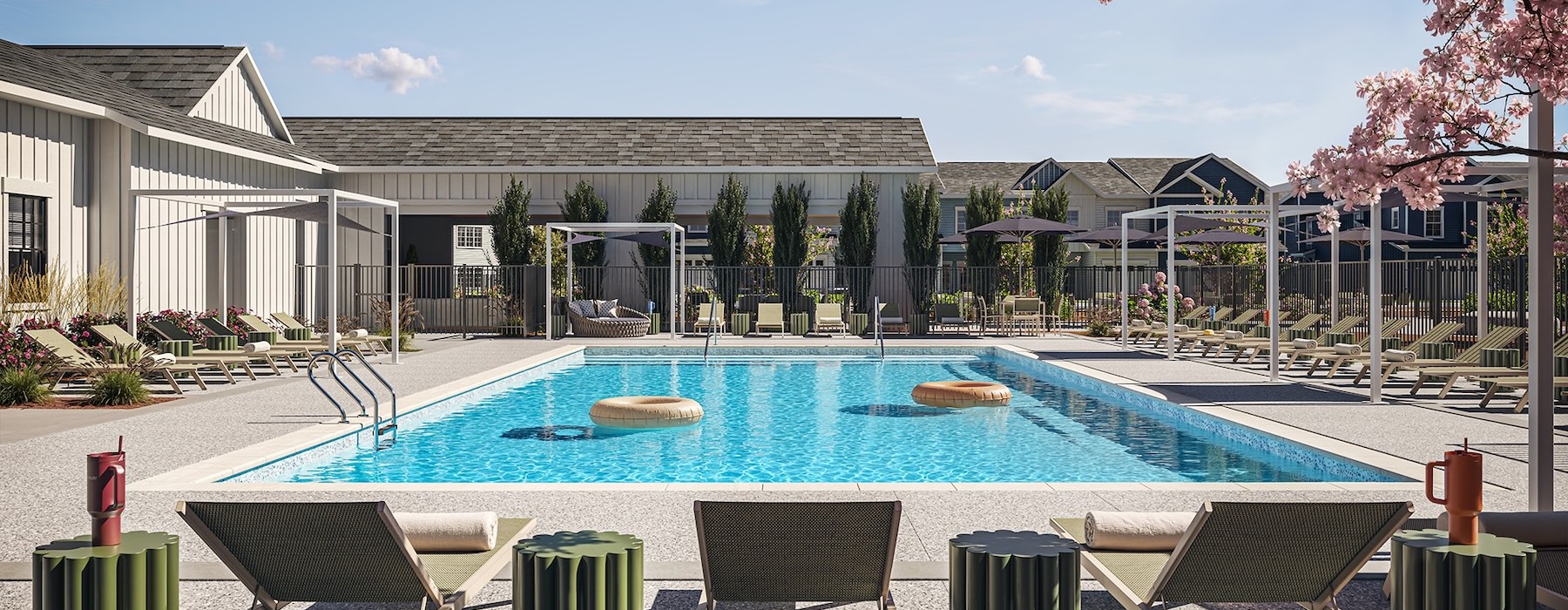 a swimming pool with lounge chairs