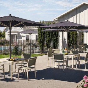 a patio with tables and chairs