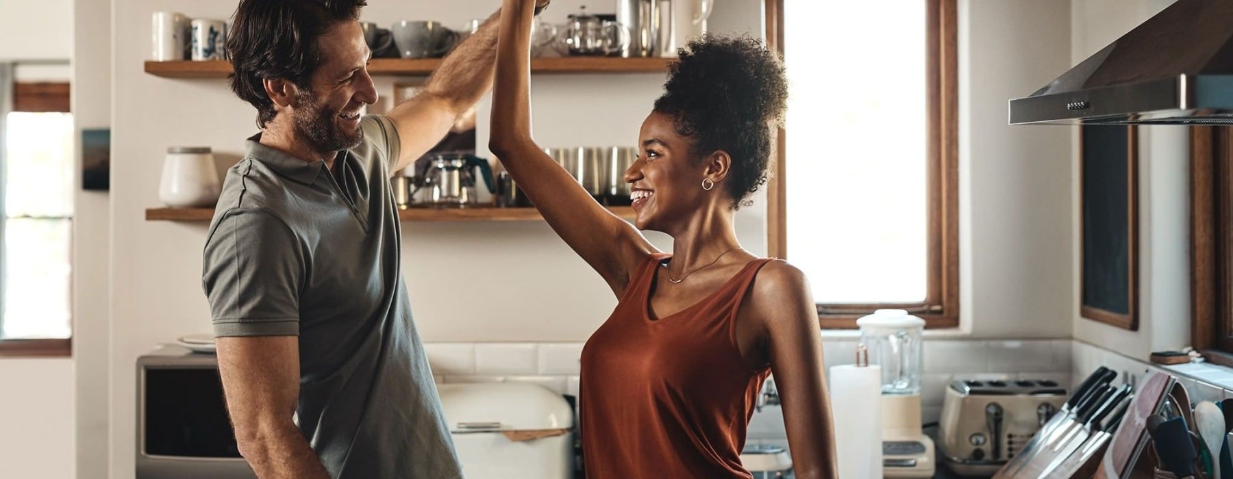 a man and a woman in a kitchen