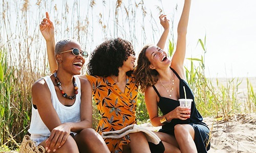 woman laughing on a beach